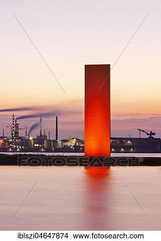 Illuminated sculpture Rheinorange in the sunset in front of industrial panorama, Rhine, Duisburg, Ruhr Area, North Rhine-Westphalia, Germany, Europe View Large Photo Image Picture - Illuminated sculpture Rheinorange in the sunset in front of industrial panorama, Rhine, Duisburg, Ruhr Area, North Rhine-Westphalia, Germany, Europe. Fotosearch
