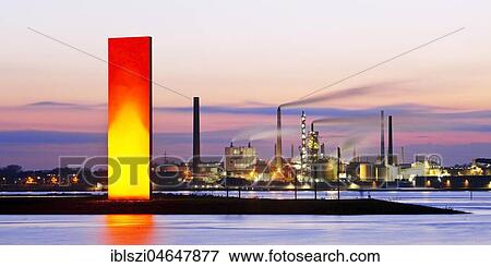 Illuminated sculpture Rheinorange in the sunset in front of industrial panorama, Rhine, Duisburg, Ruhr Area, North Rhine-Westphalia, Germany, Europe View Large Photo Image Stock Photo - Illuminated sculpture Rheinorange in the sunset in front of industrial panorama, Rhine, Duisburg, Ruhr Area, North Rhine-Westphalia, Germany, Europe. Fotosearch