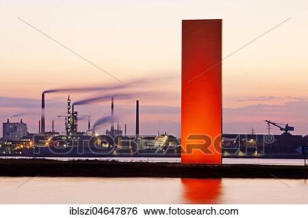 Illuminated sculpture Rheinorange in the sunset in front of industrial panorama, Rhine, Duisburg, Ruhr Area, North Rhine-Westphalia, Germany, Europe View Large Photo Image Stock Photograph - Illuminated sculpture Rheinorange in the sunset in front of industrial panorama, Rhine, Duisburg, Ruhr Area, North Rhine-Westphalia, Germany, Europe. Fotosearch