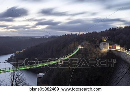 Stock Photo - Illuminated suspension bridge Titan RT at the Rappbodetalsperre, Harz, Wendefurth, Saxony-Anhalt, Germany, Europe. Fotosearch