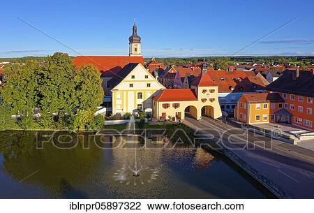 In front hospital pond with fountain, back from left, Catholic parish church of the Assumption of the Virgin Mary 1708-1710, former hospital 1730-1736, both baroque, Lower market gate with gatehouse 1323, Hotel Gasthof Seehof, Markt Allersberg, Middle... View Large Photo Image Stock Image - In front hospital pond with fountain, back from left, Catholic parish church of the Assumption of the Virgin Mary 1708-1710, former hospital 1730-1736, both baroque, Lower market gate with gatehouse 1323, Hotel Gasthof Seehof, Markt Allersberg, Middle.... Fotosearch