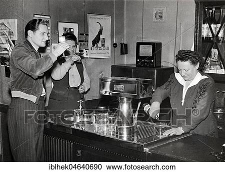 Innkeeper with guests, pub in the 1950s, exact place unknown, Germany, Europe View Large Photo Image Stock Image - Innkeeper with guests, pub in the 1950s, exact place unknown, Germany, Europe. Fotosearch