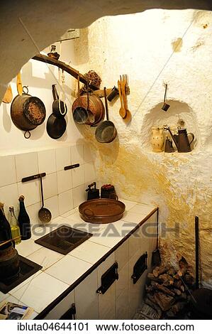 Stock Image - Interior of a cave dwelling, Museum Storica Casa Grotta di Vico Solitario, Sassi di Matera, Basilicata, Italy, Europe. Fotosearch
