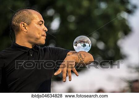 Stock Photo - Juggler with crystal ball, Kulturufer, Festival with street artists, Friedrichshafen, Lake Constance, Baden-Württemberg, Germany, Europe. Fotosearch
