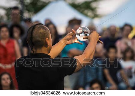 Stock Photograph - Juggler with crystal ball, Kulturufer, Festival with street artists, Friedrichshafen, Lake Constance, Baden-Württemberg, Germany, Europe. Fotosearch