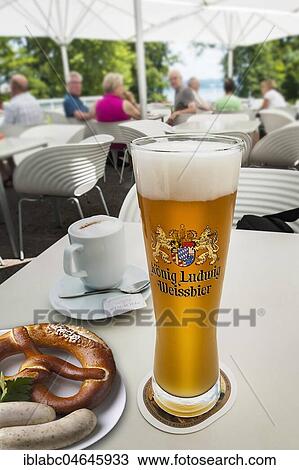Stock Image - King Ludwig Weißbier and Weißwurst with pretzel, Upper Bavaria, Bavaria, Germany, Europe. Fotosearch