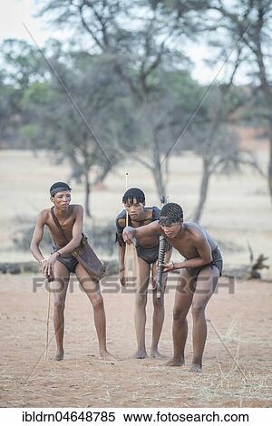 Kung Bushmen are following an animal trail, Zebra Lodge, Hardap Region, Namibia! View Large Photo Image Stock Photography - Kung Bushmen are following an animal trail, Zebra Lodge, Hardap Region, Namibia!. Fotosearch