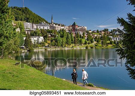 Lakeside promenade with village view over the St. Moritzersee, St. Moritz, Berninaalpen, Upper Engadine, Engadine, Grisons, Switzerland, Europe View Large Photo Image Stock Image - Lakeside promenade with village view over the St. Moritzersee, St. Moritz, Berninaalpen, Upper Engadine, Engadine, Grisons, Switzerland, Europe. Fotosearch