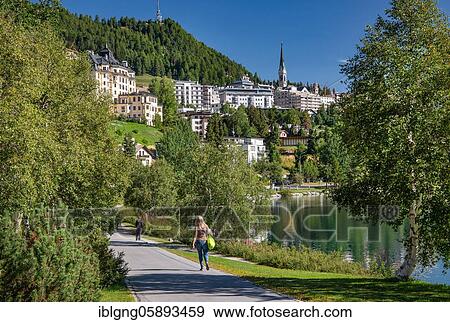 Lakeside promenade with village view over the St. Moritzersee, St. Moritz, Berninaalpen, Upper Engadine, Engadine, Grisons, Switzerland, Europe View Large Photo Image Stock Photo - Lakeside promenade with village view over the St. Moritzersee, St. Moritz, Berninaalpen, Upper Engadine, Engadine, Grisons, Switzerland, Europe. Fotosearch