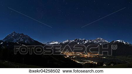 Stock Image - Landschaft im Mondlicht, Fulpmes bei Nacht unter dem Sternenhimmel, vorne die Serles, hinten die Kalkkogel, Stubaier Alpen, Stubaital, Tirol, Osterreich, Europa. Fotosearch
