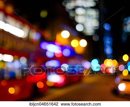 Stock Image - Light reflections from cars, lighting mood at night, London, Great Britain. Fotosearch