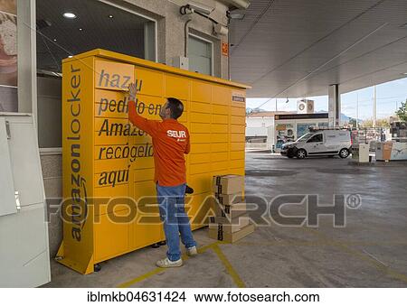 Logistics employee at Amazon Locker, packing station, self-service, Altea, Alicante, Spain, Europe View Large Photo Image Picture - Logistics employee at Amazon Locker, packing station, self-service, Altea, Alicante, Spain, Europe. Fotosearch