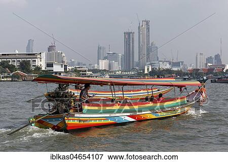 Longtail boat on the Mae Nam Chao Phraya River, skyline financial district Bang Rak, Bangkok, Thailand, Asia View Large Photo Image Stock Photo - Longtail boat on the Mae Nam Chao Phraya River, skyline financial district Bang Rak, Bangkok, Thailand, Asia. Fotosearch