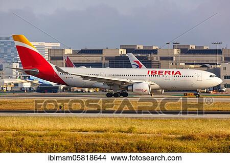 Picture - Los Angeles, United States, April 14, 2019: An Iberia Airbus A330-200 aircraft with the registration mark EC-MLB at Los Angeles Airport (LAX) in the United States, North America. Fotosearch