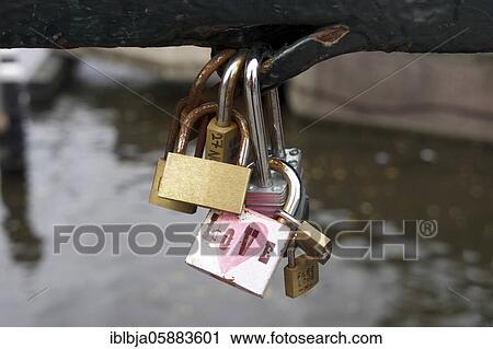 Stock Image - Love padlocks on an Amsterdam bridge, Netherlands. Fotosearch