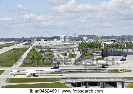 Lufthansa (Embraer ERJ-195LR and Airbus A321), passenger aircraft taxiing to runway, Munich Airport, Upper Bavaria, Germany, Europe View Large Photo Image Stock Image - Lufthansa (Embraer ERJ-195LR and Airbus A321), passenger aircraft taxiing to runway, Munich Airport, Upper Bavaria, Germany, Europe. Fotosearch