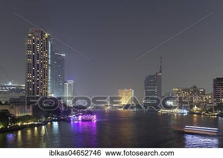 Mae Nam Chao Phraya River and Skyline at night, view from Saphan Taksin Bridge, Bangkok, Thailand, Asia View Large Photo Image Stock Photograph - Mae Nam Chao Phraya River and Skyline at night, view from Saphan Taksin Bridge, Bangkok, Thailand, Asia. Fotosearch