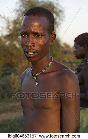 Man, ca 20 years, Hamer tribe, portrait, Turmi, region of southern nations nationalities and peoples, Ethiopia, Africa View Large Photo Image Stock Photo - Man, ca 20 years, Hamer tribe, portrait, Turmi, region of southern nations nationalities and peoples, Ethiopia, Africa. Fotosearch