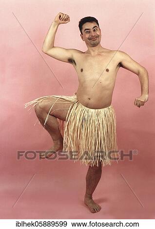 Stock Photo - Man dances in a bast skirt, Berlin, Germany, Europe. Fotosearch
