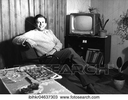 Man in his living room, 1950s, ca. 1959, exact place unknown, Germany, Europe View Large Photo Image Stock Image - Man in his living room, 1950s, ca. 1959, exact place unknown, Germany, Europe. Fotosearch