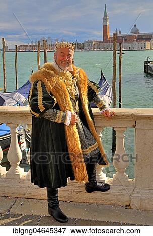 Stock Photo - Man in historical Renaissance costume at the lagoon, island of San Giorgio, carnival in Venice, Italy, Europe. Fotosearch