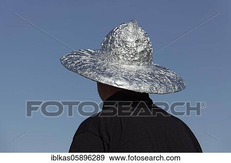 Stock Photo - Man with aluminium hat, conspiracy believer, demonstration against corona rules, Düsseldorf, North Rhine-Westphalia, Germany, Europe. Fotosearch