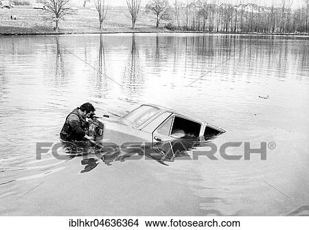Man with car in the water, ca. 1970s, exact place unknown, Germany, Europe View Large Photo Image Picture - Man with car in the water, ca. 1970s, exact place unknown, Germany, Europe. Fotosearch