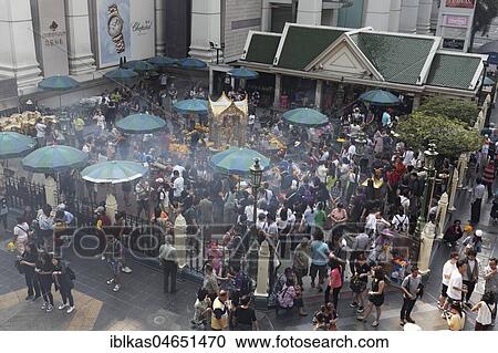 Many people at the Erawan Shrine with Hindu-God Brahma, Ratchaprasong crossing of Phloen-Chit- and Ratchadamri-Street, Pathum Wan, Bangkok, Thailand, Asia View Large Photo Image Stock Image - Many people at the Erawan Shrine with Hindu-God Brahma, Ratchaprasong crossing of Phloen-Chit- and Ratchadamri-Street, Pathum Wan, Bangkok, Thailand, Asia. Fotosearch