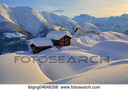 Stock Photograph - Maria zum Schnee chapel in the snow in the village centre, in the back Fletschhorn 3985m, Bettmeralp, Aletsch area, Upper Valais, Valais, Switzerland, Europe. Fotosearch