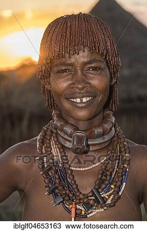 Married woman of the Hamer tribe with necklace at sunset, portrait, Turmi, region of southern nations, nationalities and peoples, Ethiopia, Africa View Large Photo Image Stock Image - Married woman of the Hamer tribe with necklace at sunset, portrait, Turmi, region of southern nations, nationalities and peoples, Ethiopia, Africa. Fotosearch