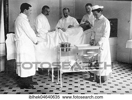 Stock Photography - Medicine, health, operation, patient, four doctors and one nurse, ca. 1930s, exact location unknown, Germany, Europe. Fotosearch