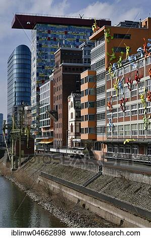 Medienhafen with Colorium Building with Innside Hotel, Roggendorf House with Flossi figures, Düsseldorf, North Rhine-Westphalia, Germany, Europe View Large Photo Image Stock Photo - Medienhafen with Colorium Building with Innside Hotel, Roggendorf House with Flossi figures, Düsseldorf, North Rhine-Westphalia, Germany, Europe. Fotosearch