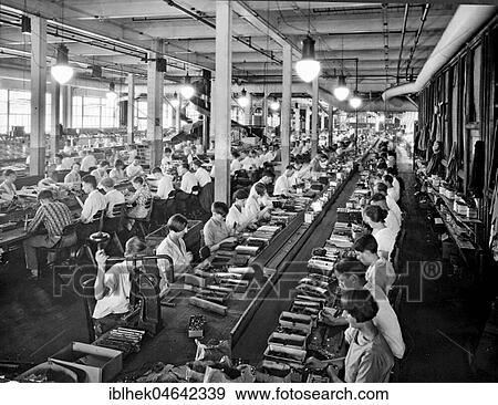 Stock Photo - Men and women at factory work, 1920s, Germany, Europe. Fotosearch