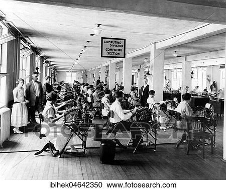Stock Image - Men and women at the typewriter, open-plan office, 1930s, USA, North America. Fotosearch