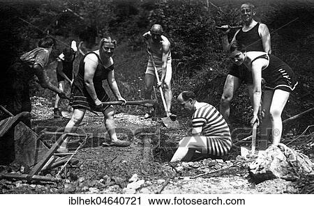 Men and women dig a hole wearing swimwear, 1930s, exact location unknown, Germany, Europe View Large Photo Image Stock Image - Men and women dig a hole wearing swimwear, 1930s, exact location unknown, Germany, Europe. Fotosearch