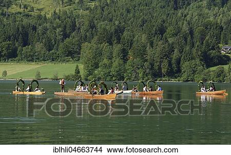 Men wearing traditional costumes in festively decorated squares, wooden boats, on the Schliersee lake, Alt-Schlierseer-Kirchtag, Schliersee, Upper Bavaria, Bavaria, Germany, Europe View Large Photo Image Picture - Men wearing traditional costumes in festively decorated squares, wooden boats, on the Schliersee lake, Alt-Schlierseer-Kirchtag, Schliersee, Upper Bavaria, Bavaria, Germany, Europe. Fotosearch