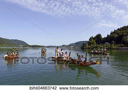 Men wearing traditional costumes in festively decorated squares, wooden boats, on the Schliersee lake, Alt-Schlierseer-Kirchtag, Schliersee, Upper Bavaria, Bavaria, Germany, Europe View Large Photo Image Stock Image - Men wearing traditional costumes in festively decorated squares, wooden boats, on the Schliersee lake, Alt-Schlierseer-Kirchtag, Schliersee, Upper Bavaria, Bavaria, Germany, Europe. Fotosearch