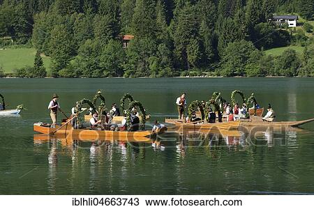 Men wearing traditional costumes in festively decorated squares, wooden boats, on the Schliersee lake, Alt-Schlierseer-Kirchtag, Schliersee, Upper Bavaria, Bavaria, Germany, Europe View Large Photo Image Stock Image - Men wearing traditional costumes in festively decorated squares, wooden boats, on the Schliersee lake, Alt-Schlierseer-Kirchtag, Schliersee, Upper Bavaria, Bavaria, Germany, Europe. Fotosearch