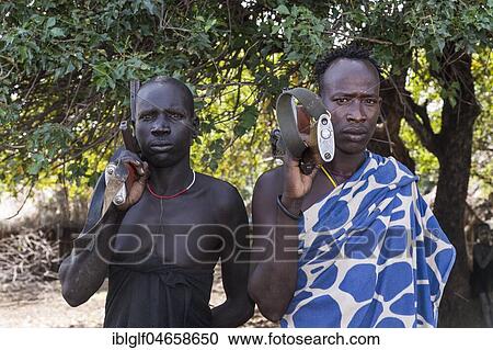 Men with Kalashnikovs, AK47, warriors, Mursi tribe, Southern Nations Nationalities and Peoples' Region, Ethiopia, Africa View Large Photo Image Stock Image - Men with Kalashnikovs, AK47, warriors, Mursi tribe, Southern Nations Nationalities and Peoples' Region, Ethiopia, Africa. Fotosearch