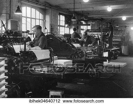 Stock Image - Men working in a print shop, 1950s, exact location unknown, Germany, Europe. Fotosearch