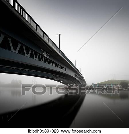 Stock Image - Minna Todenhagen Bridge at Nebel, connects Oberschöneweide with Niederschöneweide, Treptow-Köpenick, Berlin, Germany, Europe. Fotosearch