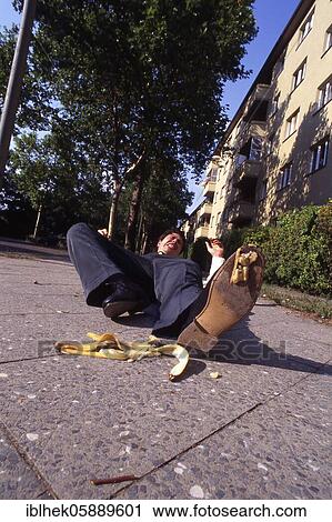 Stock Image - Misfortune, man slips on banana peel, Berlin, Germany, Europe. Fotosearch