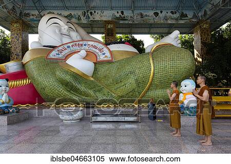 Stock Photography - Monks in front of a Chinese Buddha, Wat Pa Thamma Utthayan, Khon Kaen, Isan, Thailand, Asia. Fotosearch