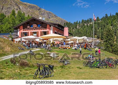 Stock Photography - Mountain hotel with sun terrace in Roseg Valley, Val Roseg, Pontresina, Bernina Alps, Upper Engadine, Engadine, Grisons, Switzerland, Europe. Fotosearch
