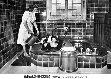 Stock Photography - Mud bath, 1940s, Germany, Europe. Fotosearch