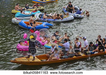 Stock Image - Nabada, event on Schwörmontag, boats, water vehicles, people on the Danube, Ulm, Baden-Württemberg, Germany, Europe. Fotosearch