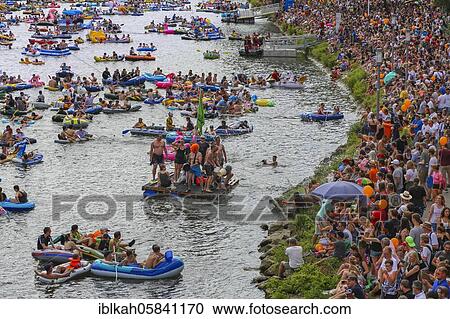 Stock Image - Nabada, event on Schwörmontag, boats, water vehicles, people on the Danube, Ulm, Baden-Württemberg, Germany, Europe. Fotosearch