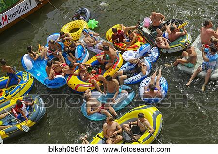 Stock Photograph - Nabada, event on Schwörmontag, boats, water vehicles, people on the Danube, Ulm, Baden-Württemberg, Germany, Europe. Fotosearch
