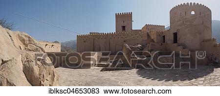 Stock Image - Nakhl Fortress, tower and stone wall with battlements, Nakhl, Oman, Asia. Fotosearch