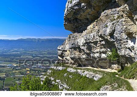 Stock Photo - Narrow balcony path La Corraterie with panoramic view of the Geneva basin, Mont Salève peak, Collonges-sous-Salève, Haute-Savoie, France, Europe. Fotosearch